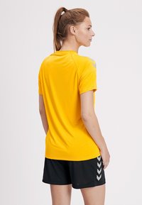 Hummel TECH MOVE - T-Shirt print - yellow