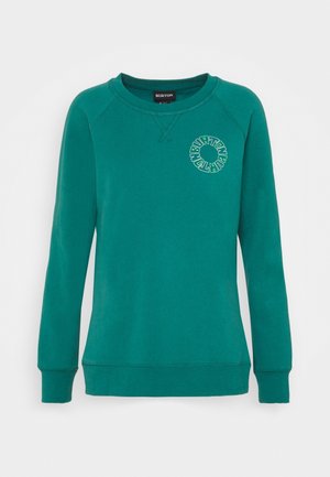 Sudadera de cuello redondo y manga larga en color verde azulado con el nombre de la marca Burton en un logo circular en el pecho izquierdo y puños y bajo acanalados.