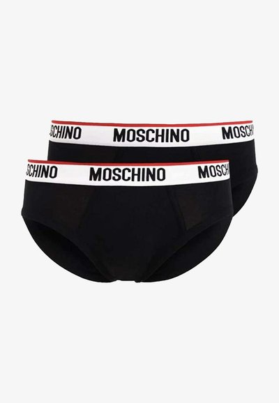 Črne bombažne hlačke z širokim belim pasom, na katerem je v črnem besedilu zapisano "MOSCHINO", obogatenim z rdečo črto. Paket vsebuje dve pari.