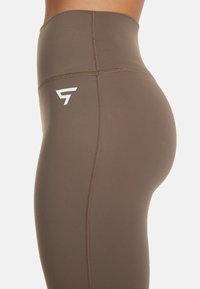 SQUATPROOF BRISK SPORT FLARE  - Leggings - Trousers - caramel brown