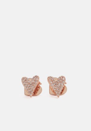 Boucles d'oreilles en forme de cœur en or rose ornées de petits cristaux transparents sur fond blanc.