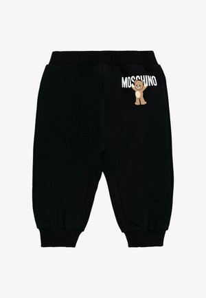 Czarne spodnie dresowe z prążkowanym paskiem w talii i mankietami, z rysunkiem kreskówkowego niedźwiedzia oraz napisem "Moschino" z boku. Miękka tekstura materiału.