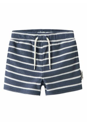 Granatowe krótkie spodenki dla małych dzieci z białymi poziomymi paskami, elastycznym pasem, białym sznurkiem i małą boczną metką.