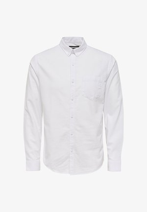 Valge pika käisega nööpidega särk, mis on valmistatud puuvillast, kaasa arvatud krae, esine nööpidega ja üks rinnaäärne tasku. Sujuv tekstuur.