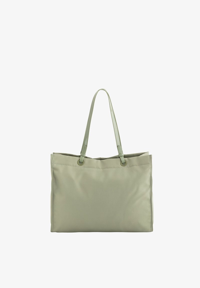 Light green tote bag made from smooth fabric, featuring two long handles and contrasting stitching along the edges. Simple rectangular shape.
