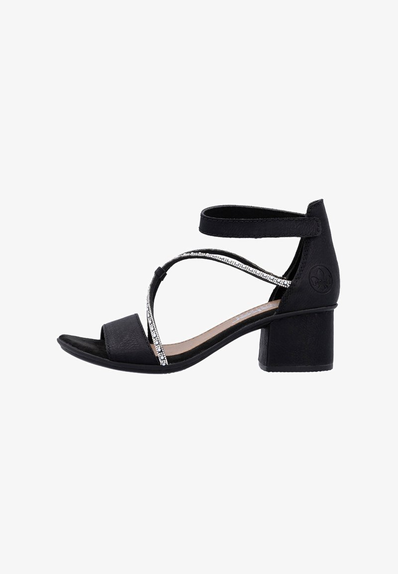 Black sandal with a block heel, featuring cross straps adorned with small silver accents. Made of textured synthetic material.