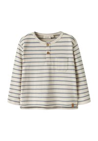 Pasiasta koszula z długim rękawem w kolorze kremowym z jasnoniebieskimi i granatowymi paskami. Posiada okrągły dekolt, pliskę z trzema guzikami oraz kieszeń na piersi.