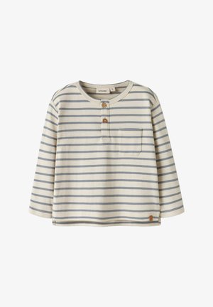 Gestreiftes Langarmhemd in Creme mit hellblauen und marineblauen Streifen. Mit rundem Ausschnitt, Drei-Knopf-Leiste und Brusttasche.