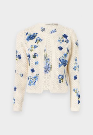 Κιτρινόλευκη πλεκτή ζακέτα με μπλε ανθικά κεντήματα, μακριά μανίκια και ανοιχτό μπροστινό μέρος, εκτεθειμένη σε απλό φόντο.