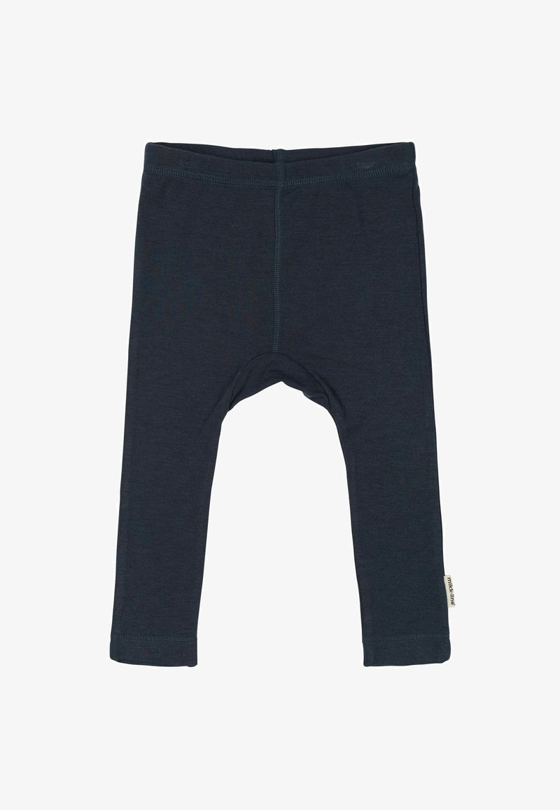 Temno modri leggingi iz mehkega materiala. Imajo oprijet kroj, ravne hlačnice in dolžino do gležnjev z majhno oznako na robu.