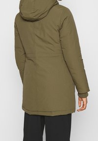 Tommy Jeans Dunkappa / -rock - olive