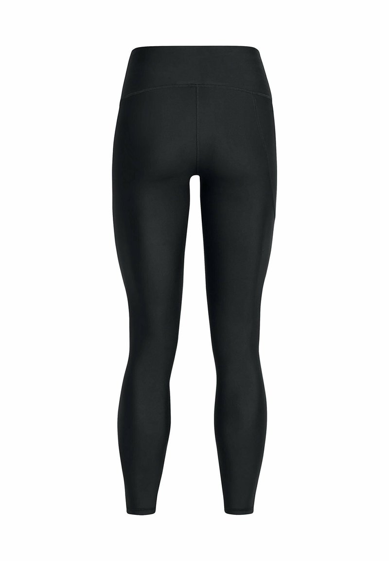 Leggings negras con cintura alta, fabricadas con un tejido elástico, que presentan una textura suave y un diseño ajustado que se adapta al cuerpo.