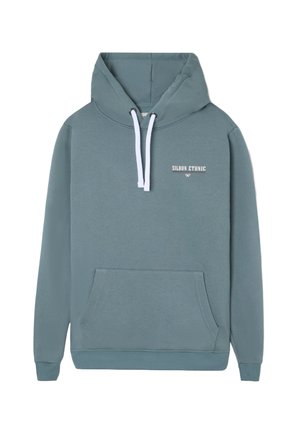 Sudadera azul-verde con cordones blancos, bolsillo tipo canguro frontal y texto "Silbon Étnico" en el pecho.