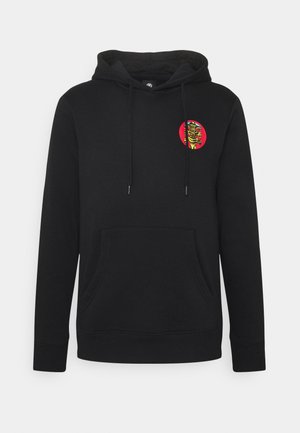 Schwarzer Hoodie mit Fronttasche, Kordelzugkapuze und kleinem buntem Skelett-Grafik in einem roten Kreis auf der oberen linken Brust.
