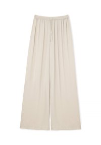Pantalons larges beige en tissu doux. Ils sont dotés d'une taille élastique avec un cordon de serrage pour un ajustement réglable. Texture lisse, sans motifs.