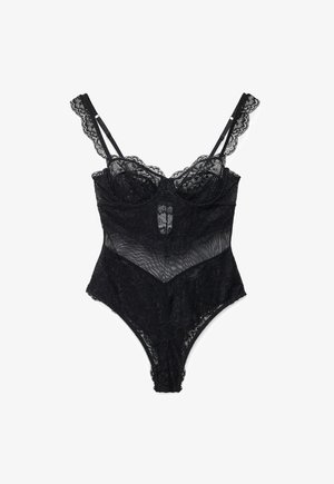 Juodas nėrinių bodis su reguliuojamomis petnešėlėmis, lankeliais krūtinės srityje ir permatomais tinkliniais intarpais, išdėliotas plokščiai ant balto fono.