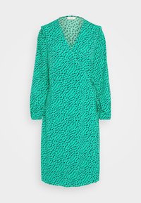 Grünes Kleid mit V-Ausschnitt, langen Puffärmel und einem schwarzen Herzmuster auf der gesamten Fläche. Hergestellt aus leichtem, strukturiertem Stoff.