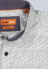 Men's button-up shirt with white background and black vine leaf pattern, dark inner collar trim, and Emilio Adani brand label.