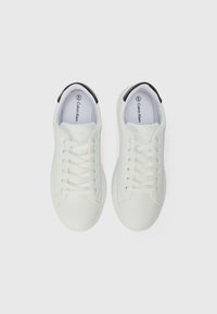White leather sneakers featuring a smooth texture, round toe design, lace-up closure, and a black accent at the heel. Size 40 inscribed inside.