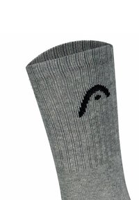 Graue gerippte Socke mit einem schwarzen, geschwungenen Design nahe dem oberen Rand, vor weißem Hintergrund dargestellt.