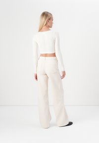 ONLY ONLMADISON WIDE - Wide leg - ecru