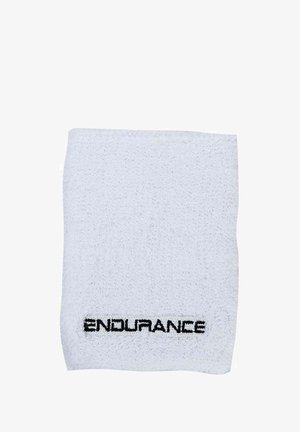 Vit bomullshandduk med texturerad yta och sydda kanter, med texten "ENDURANCE" i svart längst ner.