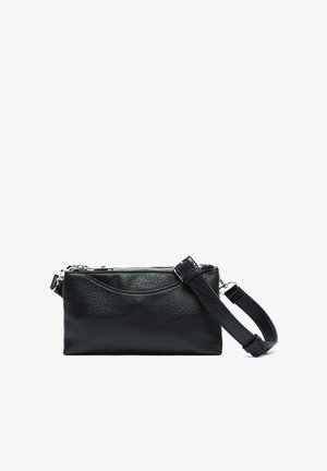 Black leather crossbody bag with textured finish, zip closure, and adjustable strap. Compact rectangular shape with subtle curved detailing.