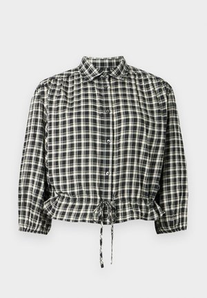 Blusa a quadri neri e crema con scollo con colletto, chiusura con bottoni e vita elasticizzata con coulisse. Maniche lunghe con polsini.