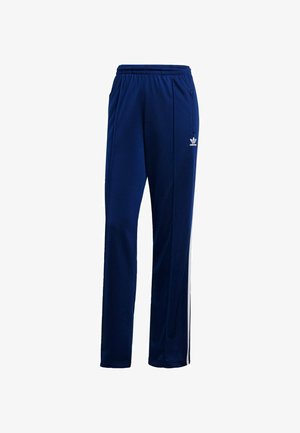 Marineblaue Sporthose aus glattem Material mit elastischem Bund, Seitentaschen und weißen Streifen an den Seiten. Adidas-Logo.