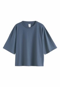 Hellblaue, übergroße T-Shirt aus Baumwolle mit kurzen Ärmeln, Rundhalsausschnitt und glatter Textur, im minimalistischen Design.