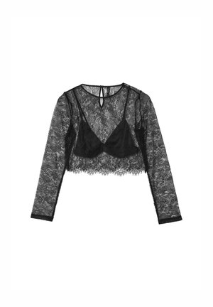 Top corto in pizzo nero con maniche lunghe, caratterizzato da un pannello trasparente e una scollatura a V. Il tessuto presenta un delicato motivo floreale e una morbida texture.