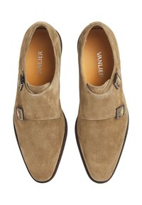 Suede, beige dress shoes with a slightly pointed toe, single buckle accent, and a smooth leather lining. Flat, thin rubber sole.