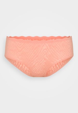 Ferskenfarget blonde truse med bølget talje. Har et teksturert mønster med delikate linjer. Mykt, lett stoff designet for komfort.