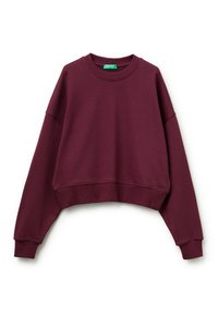 Sudadera corta burdeos hecha de material suave. Presenta un cuello redondo, hombros caídos y puños y dobladillo acanalados. Detalle sutil del logo en el dobladillo.