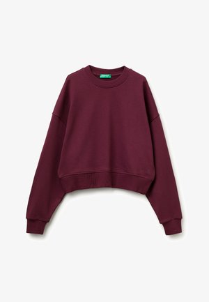 Bordeaux cropped sweatshirt gemaakt van zacht materiaal. Heeft een ronde hals, drop shoulders en geribde manchetten en onderkant. Subtiele logo detail aan de onderkant.