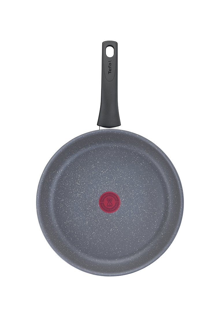 Antihaftbeschichtete graue Bratpfanne mit gesprenkelter Oberfläche und schwarzem Griff, mit einem roten Wärmeindikator in der Mitte.