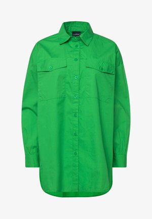 Chemise boutonnée verte avec un col pointu, deux poches poitrine, des manches longues et un ourlet légèrement arrondi. Tissu texturé et léger.