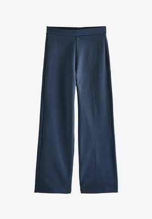 Navyblaue, weite Hosen aus weichem, dehnbarem Stoff. Sie verfügen über einen glatten, elastischen Bund und klare Linien ohne zusätzliche Verzierungen.