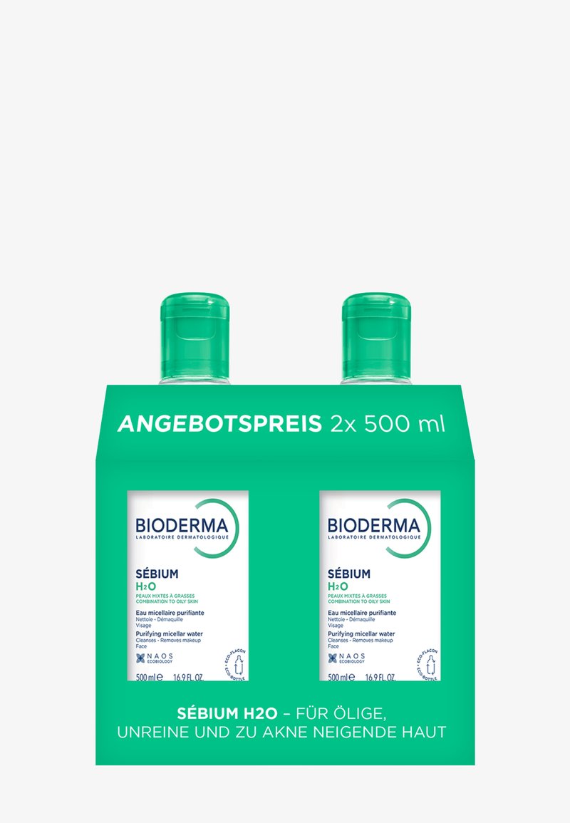 Zwei 500 ml Bioderma Sébium H2O reinigende Mizellenwasser-Flaschen in grüner Verpackung für fettige, zu Akne neigende Haut.