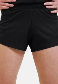 Schwarze Sportshorts mit elastischem Bund und glatter Textur, die f�ür Komfort und Bewegungsfreiheit konzipiert sind.