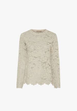 Langærmet top lavet af beige blonder med blomsterprint, bølget kant og en rund halsudskæring med en jævn finish hele vejen rundt.