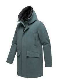 Zöld kapucnis télikabát fekete párnázott bélésbel, elülső cipzárral, patentgombokkal és több zsebbel az elején és az oldalán.