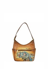 Bruine leren schoudertas met een gebogen vorm, voorzien van een kleurrijk olifantenontwerp en een vooraanstaande ritszak. Gouden hardware accenten.