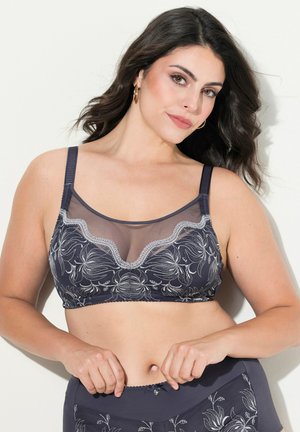 Navy-BH mit transparentem Netzpaneel, floraler Stickerei in Weiß, gewelltem Ausschnitt, verstellbaren Trägern und weichem Stoffgefühl.