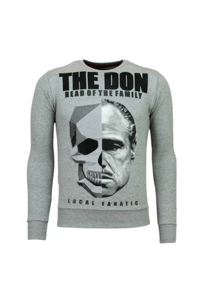 Grijs shirt met lange mouwen met de tekst "THE DON HEAD OF THE FAMILY" en een gesplitste afbeelding van een schedel en een mannengezicht op de voorkant.