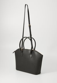 Black structured handbag in textured material, featuring dual top handles, a detachable shoulder strap, and a gold zipper closure.