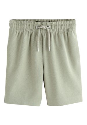 Shorts gris clair à taille élastique avec cordon frontal et texture diagonale subtile, posé à plat sur fond blanc.