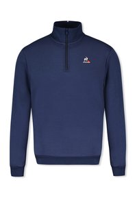 Tmavě modrý pulovr s límcem na zip, zdobený vyšitým logem na levé straně hrudi. Vyrobený z měkké látky s hladkou texturou.