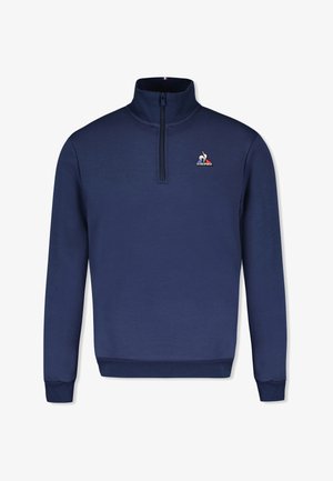 Maglione blu navy con collo con zip, caratterizzato da un logo ricamato sul petto sinistro. Realizzato in tessuto morbido con una texture liscia.