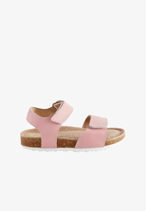 Sandal cu piele roz, dotat cu două curele ajustabile din velcro, talpă din plută, talpă din cauciuc alb și textură ușoară pe interior.